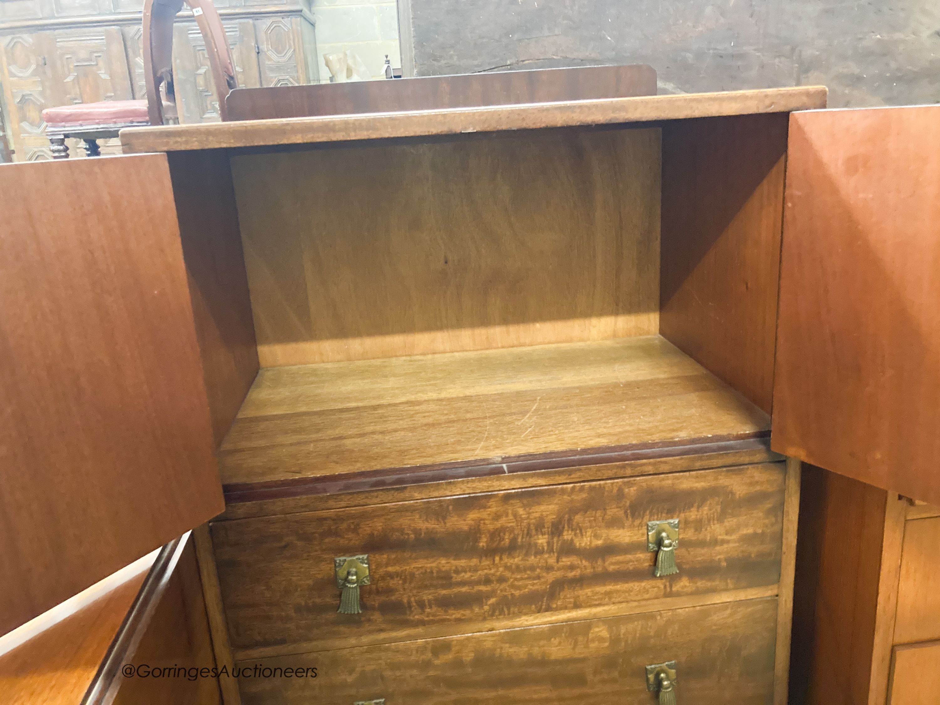 A 1920's mahogany three drawer side cabinet, stamped Waring & Gillow, W.61cm D.44cm H.110cm